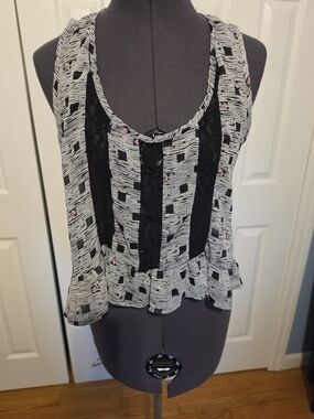 Sleeveless Black & White Peplum Tank with Lace Insets